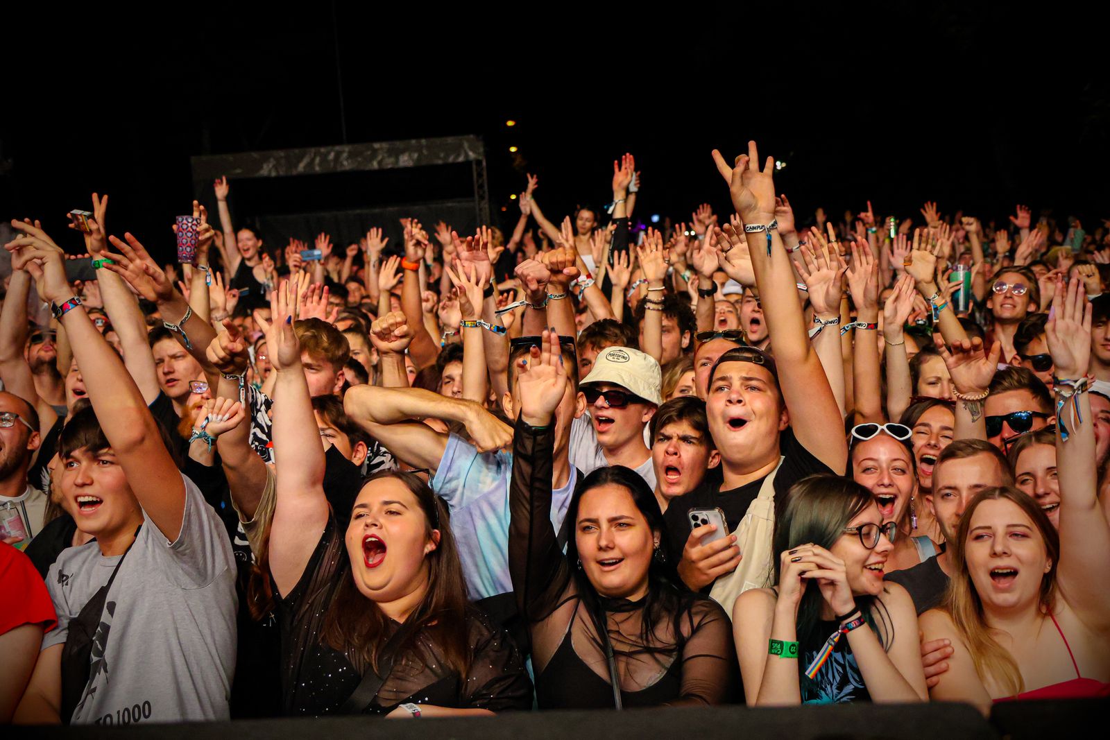 Large night-time festival crowd viewed as a dense mass, evoking crowd analytics and audience measurement