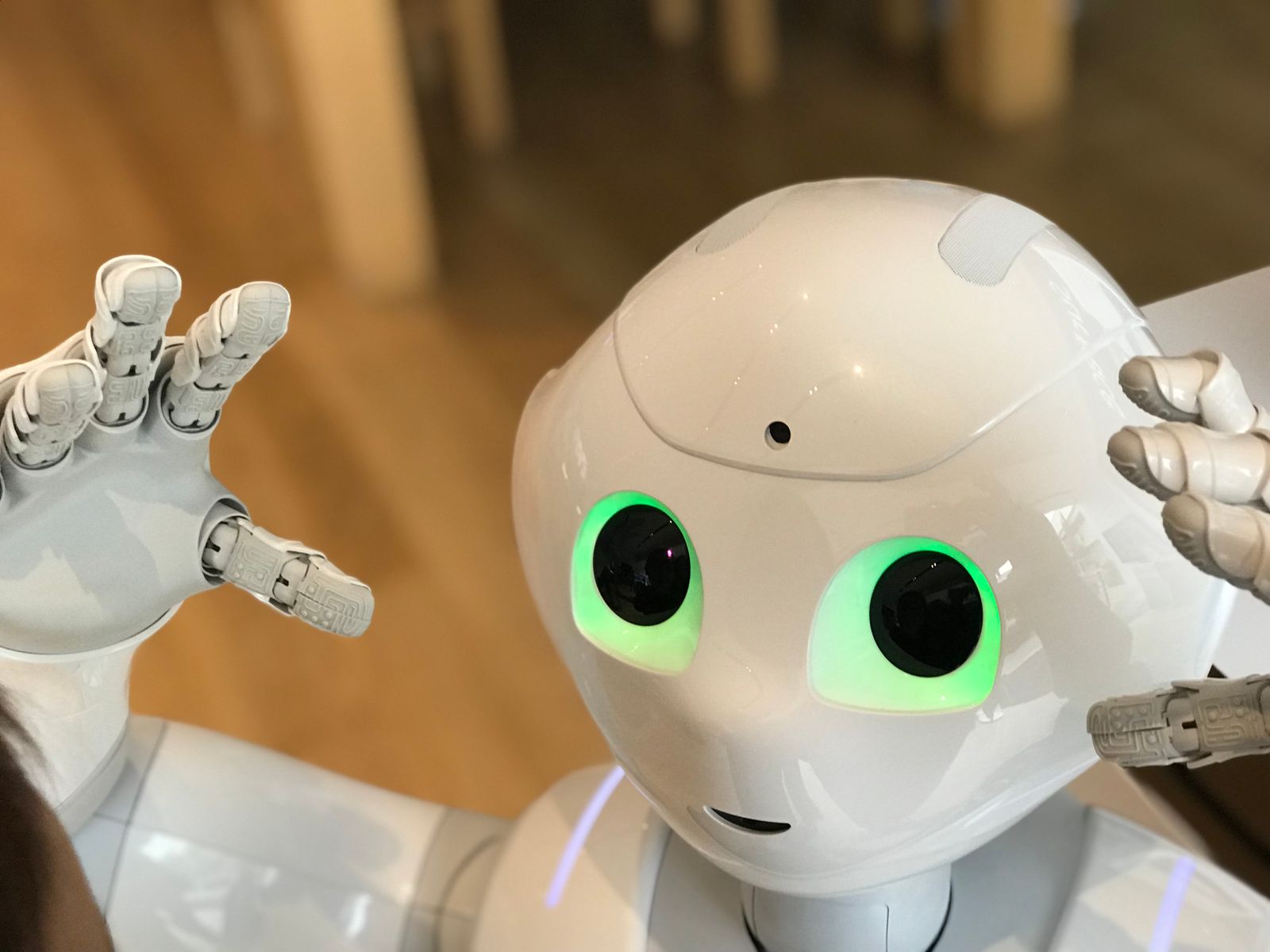 A white humanoid robot with glowing eyes, representing unsanctioned shadow AI in the workplace