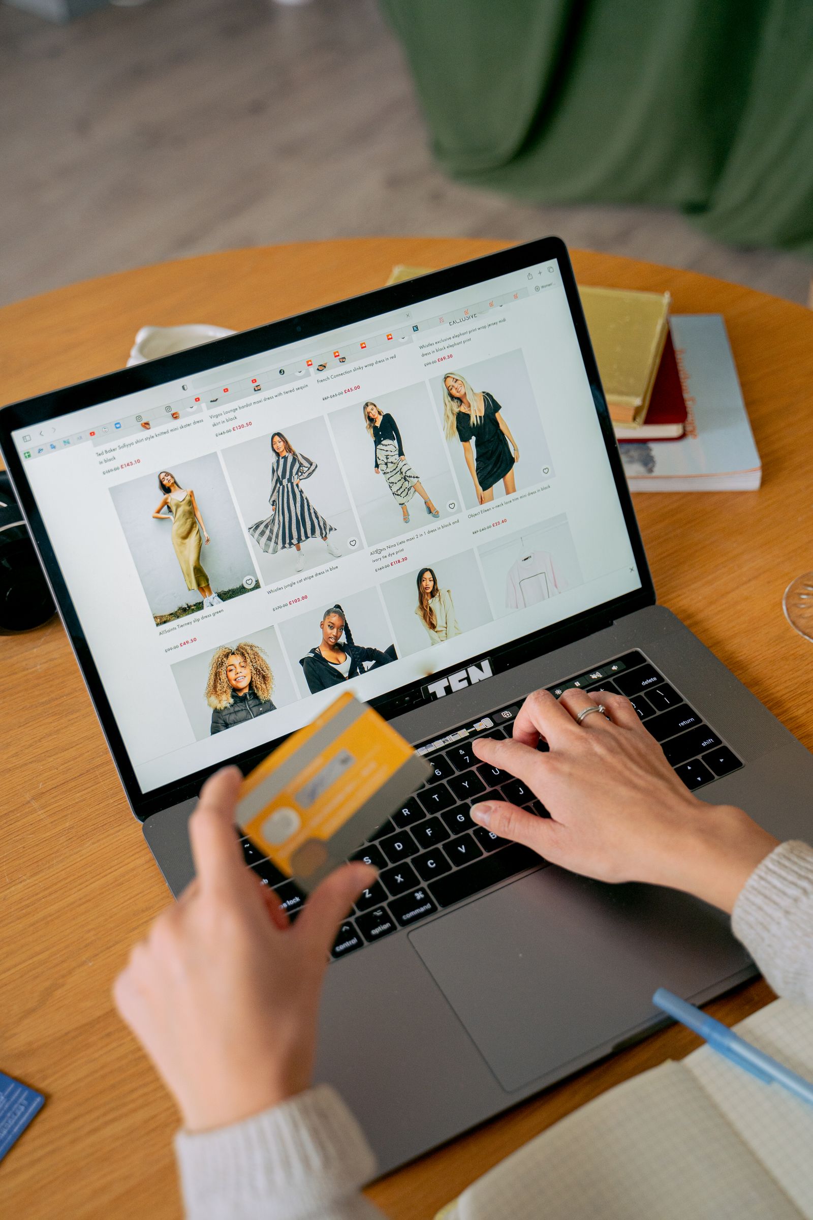 A woman making an online purchase on a laptop while browsing an online store, representing an Amazon shopping study