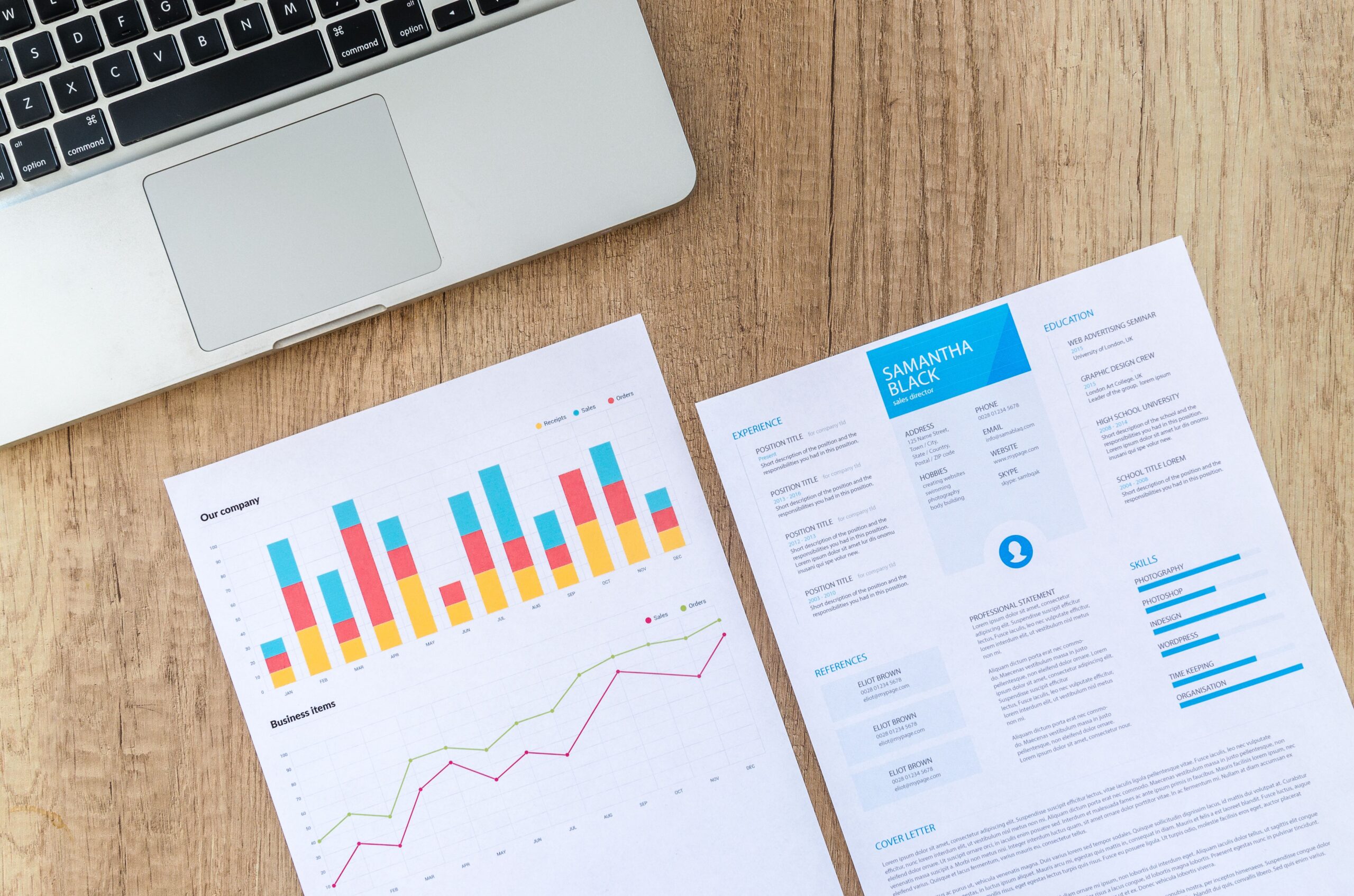 Colourful analytics charts and graphs on paper representing AI search visibility and GEO performance tracking